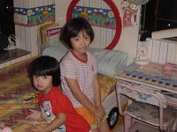 A couple of children sitting on the floor